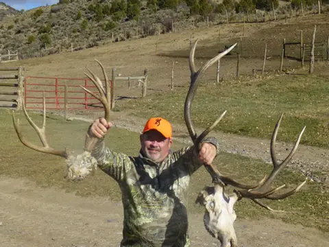 Hunter holding up a set of elk antlers