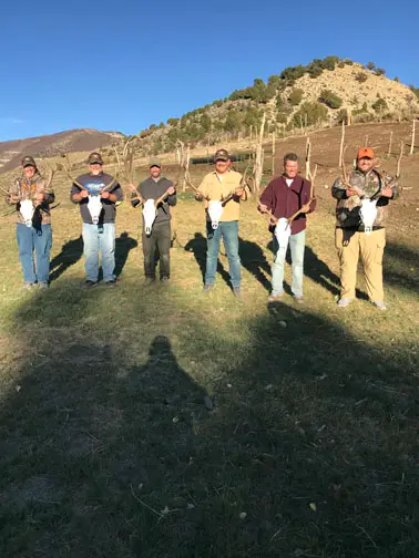 Group of hunters with their antlers